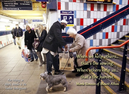 Hussain, a 34 year old Muslim convert, helps an elderly lady with her bags at a train station in London, December 5, 2011. Hussain, formerly Jason Thomas, whose family are Christians and originate from the Caribbean, adopted the religion after a troublesome upbringing saw him end up homeless and eventually imprisoned.  "I got involved in robbing shops and business people and stealing designer clothes from the West End's expensive shops. My life consisted of waking up in the morning, smoking weed, hanging out on the council estate and doing crime," he said.  "But when I was in prison, I thought there must be more to life than just robbing and stealing." Thomas, who now visits socially deprived areas and counsels troubled youths against committing crime, was taken to the Brixton Mosque in South London by his cousin, who introduced him to Islam. Picture taken December 5, 2011.        REUTERS/Danish Siddiqui (BRITAIN - Tags: RELIGION SOCIETY)